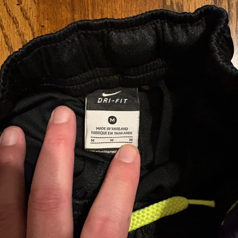 Nike Elite Black and Purple Athletic Shorts with Yellow Accents - Picture 3 of 3